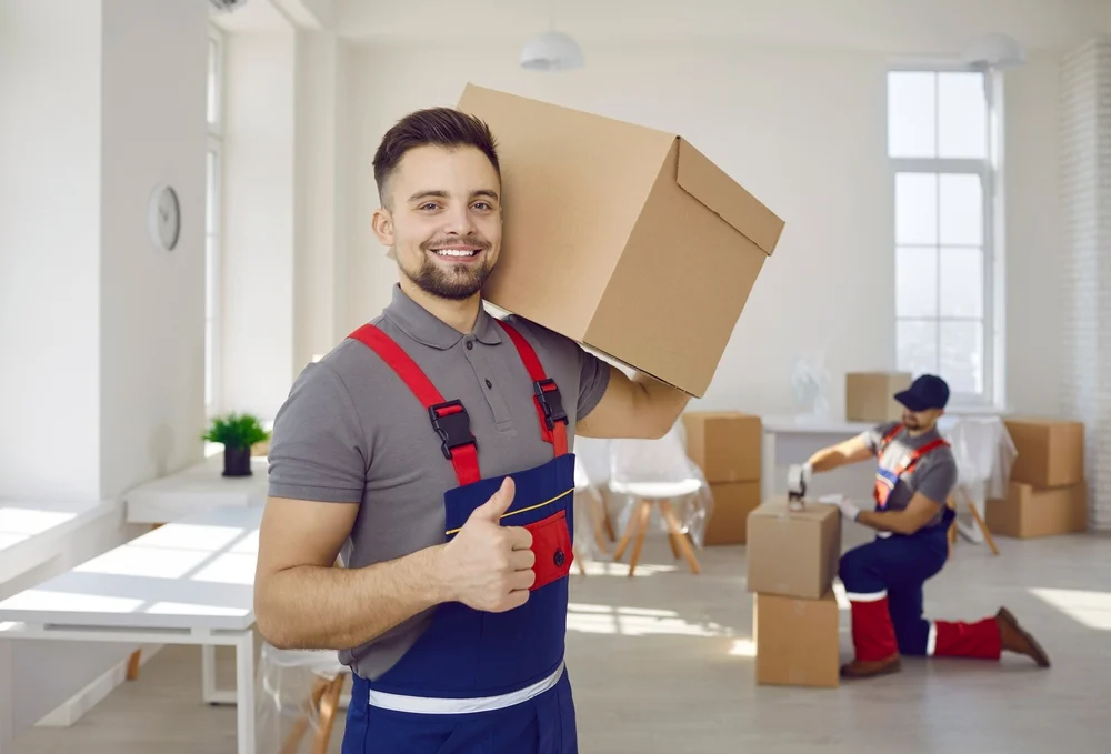 Giant movers carefully moving boxes for residential moving proving our word as best local movers in dubai